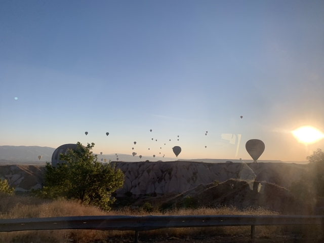 Hot air balloons over the rock formations of Cappadocia.