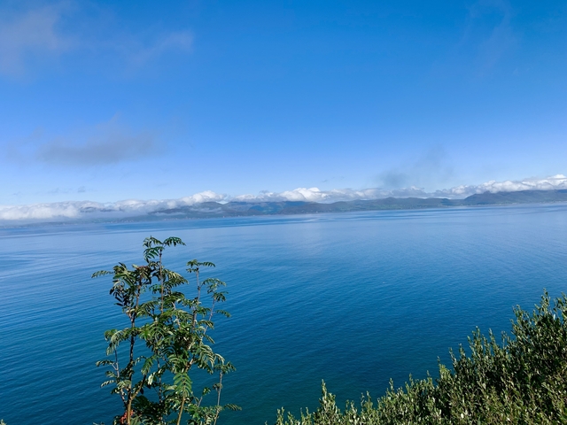 Clear blue sea under a bright sky.