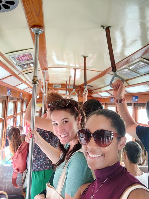       People on a traditional tram ride.
  