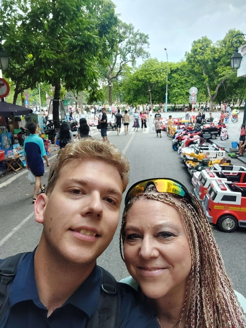Group of people exploring a bustling street market.