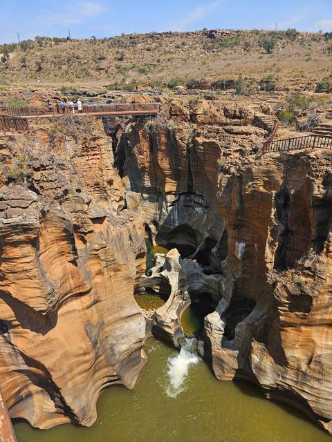       Bourke's Luck Potholes with water flowing through.
  