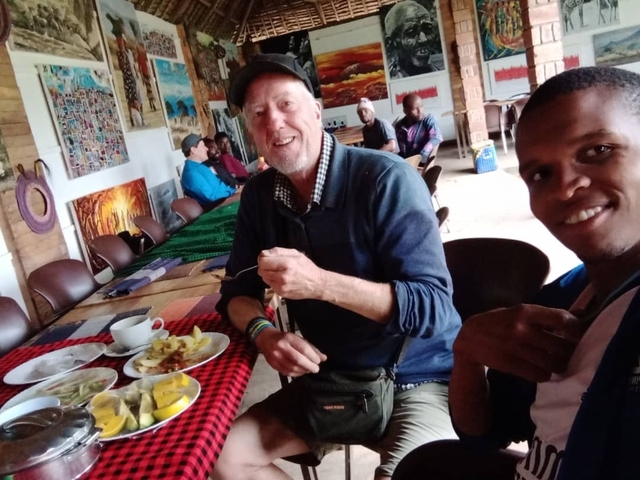 People dining in a colorful indoor setting.