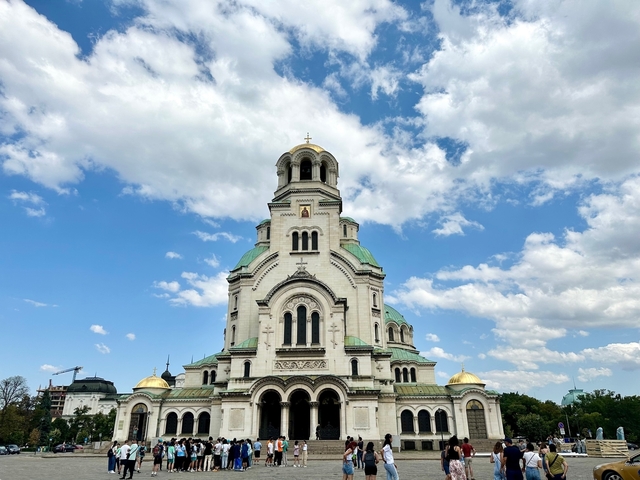 Large, ornate church under a blue sky.