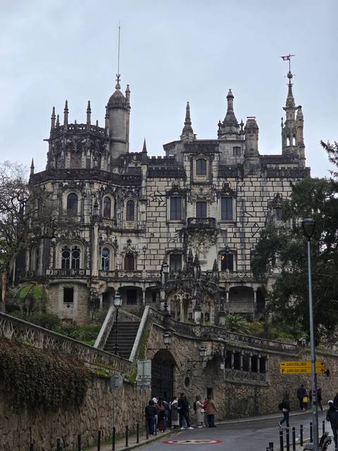 A classic architectural building with visitors.