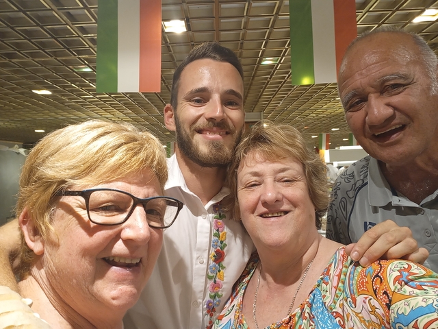Group selfie with people smiling.