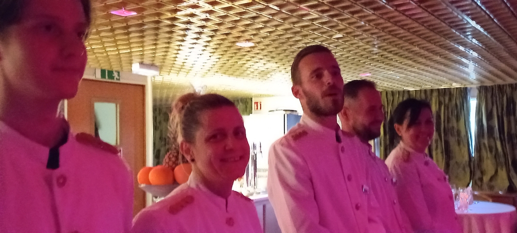 Group of people in a dimly lit room.