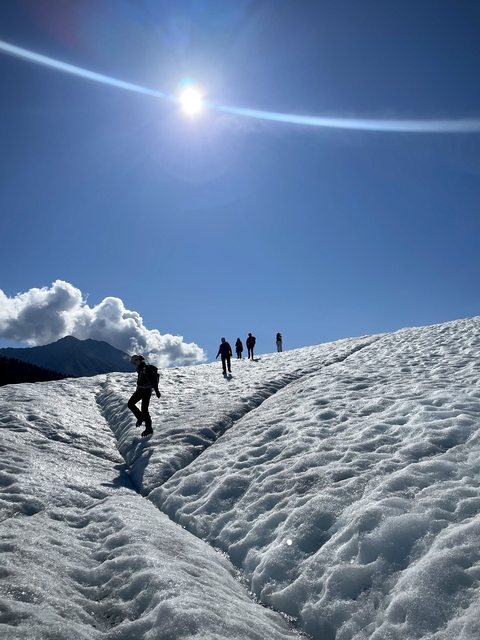       Group of people hiking on a glacier
  
