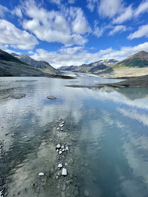       Glacial lake with mountains in the background
  