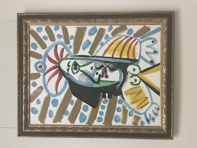       Colorful abstract painting in a frame.
  