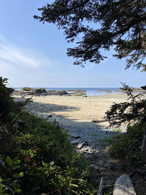 Secluded beach with rocky formations and ocean view.
