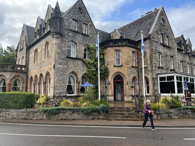 Historic stone building with arched windows.