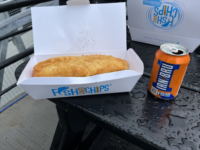 Box of fish and chips and a can of soft drink.