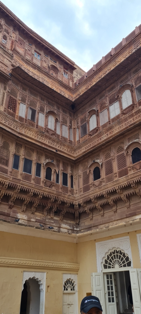      Detailed view of an intricately carved palace facade.
  