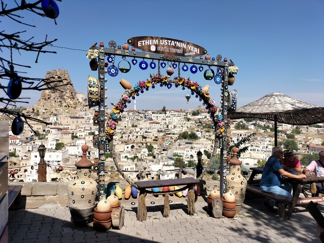 Panoramic view of a rocky hilltop town with decorative charm.