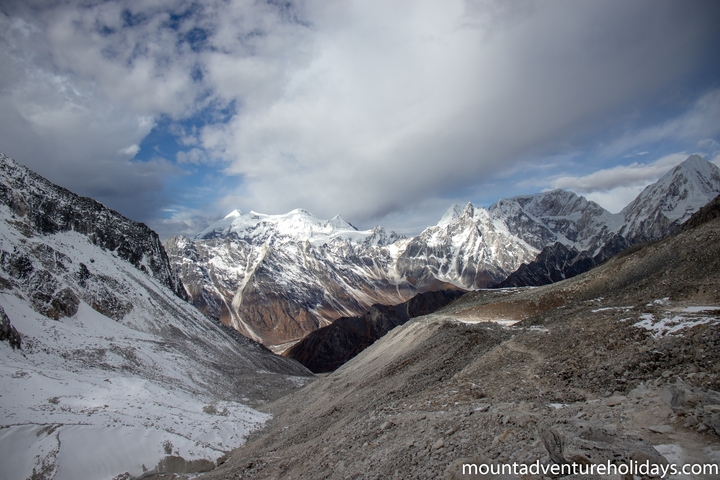 Panoramic view of a mountain range with snow-capped peaks.