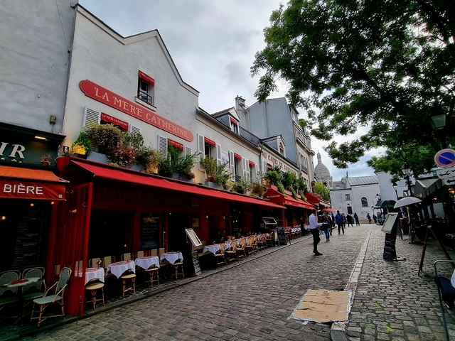 La Mère Catherine restaurant with red awnings.