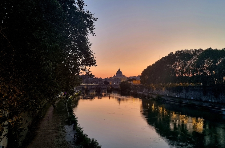 River view with Vatican dome at sunset.