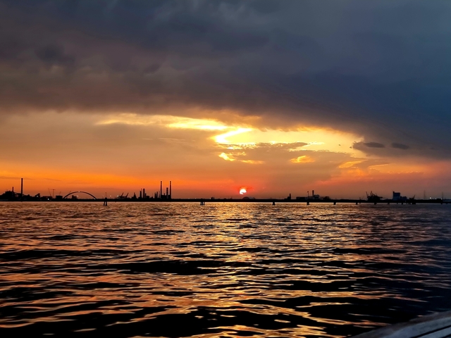 A dramatic sunset over water.