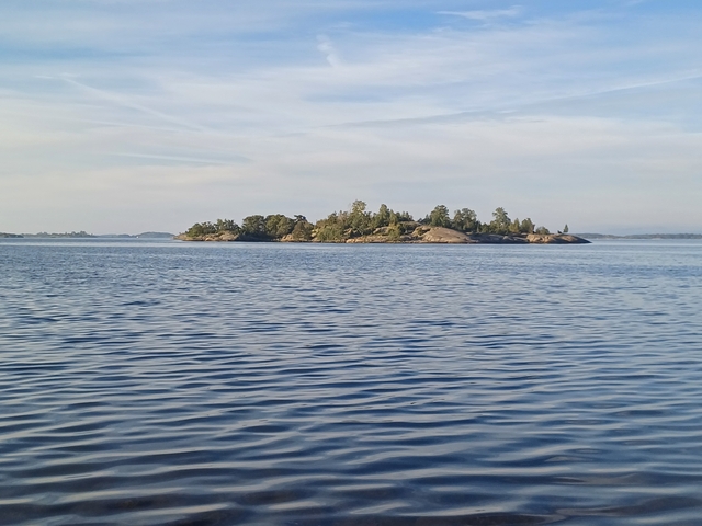 View of a small island in the sea.