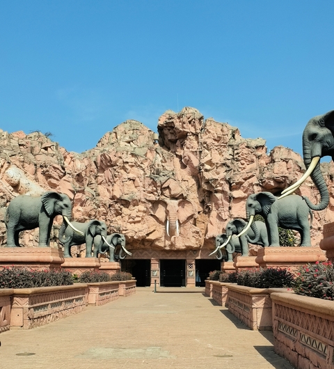 Elephant statues at an entrance to a park.