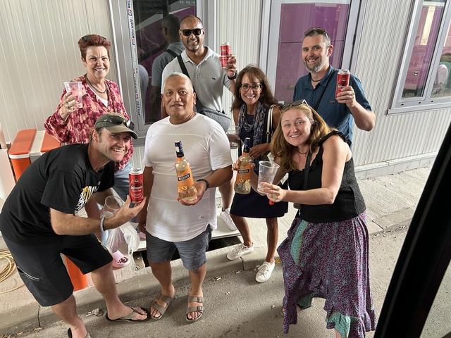       A group of people celebrating with drinks.
  