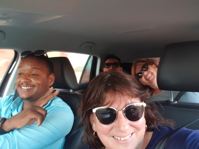 Group of people inside a car having fun.