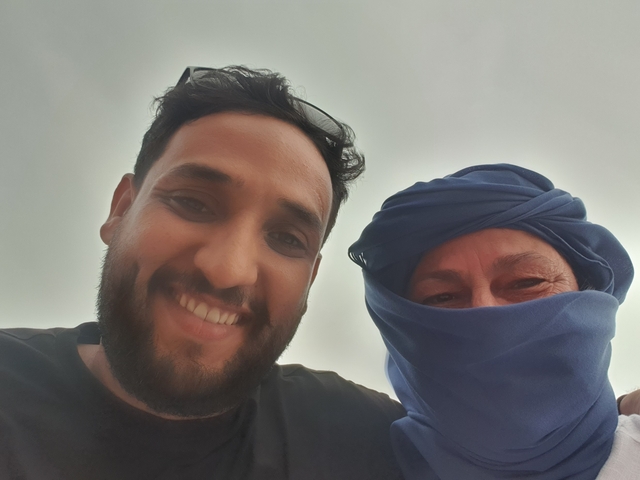 Selfie of two people with a traditional headscarf.