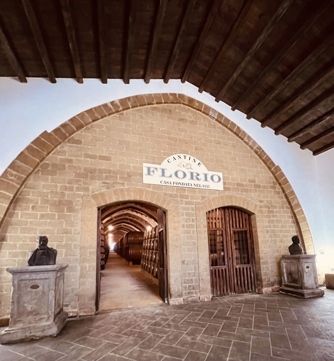 Entrance to a historic winery with stone archway.