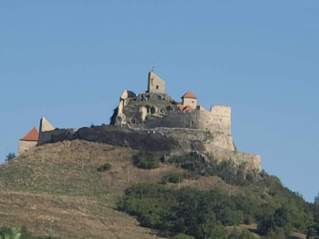       Distant view of a hilltop fortress.
  
