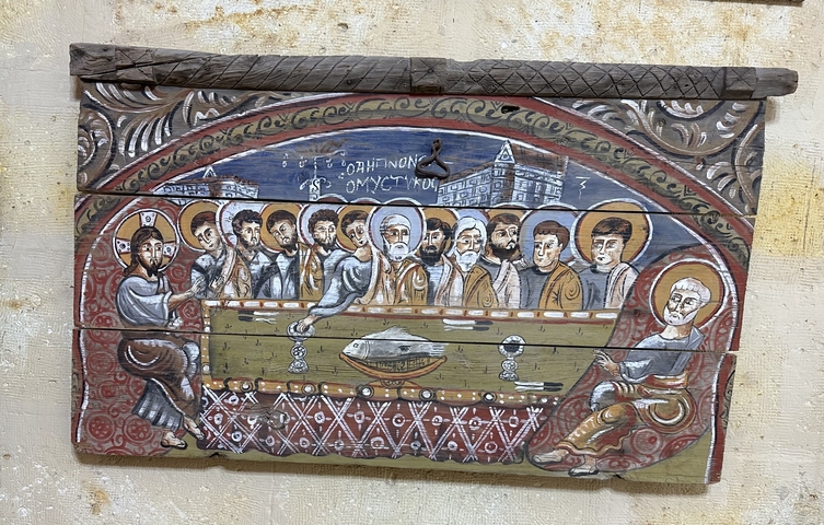       Wooden artwork depicting a historic scene.
  