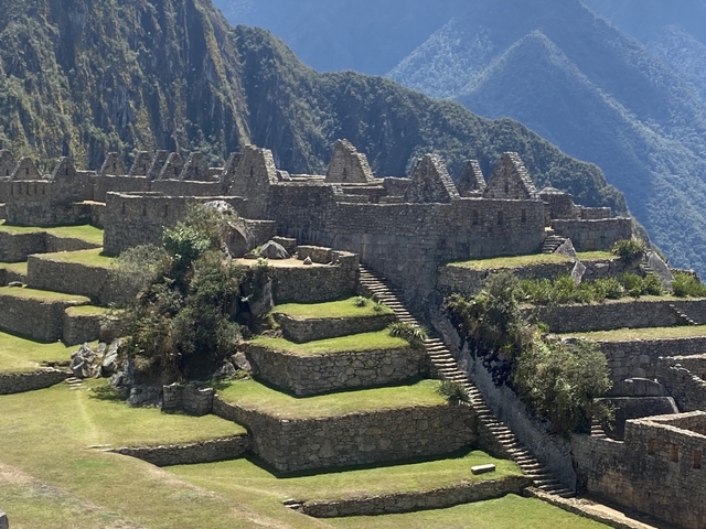 Ancient stone ruins on a mountain with clear skies.