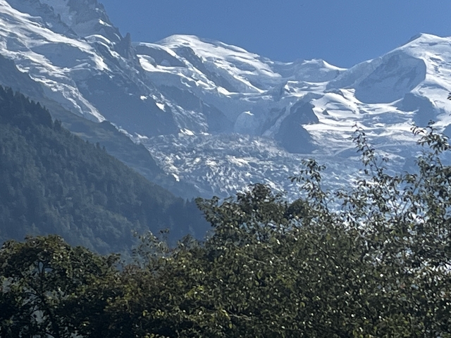 Snow-capped mountain peaks under a clear blue sky.