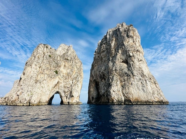 Twin rocky cliffs emerging from the sea.