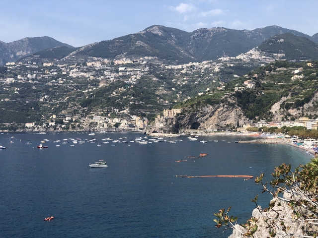       Expansive view of Amalfi Coast with mountains and sea.
  