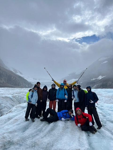 Group of people on a hiking trip in a snowy landscape.