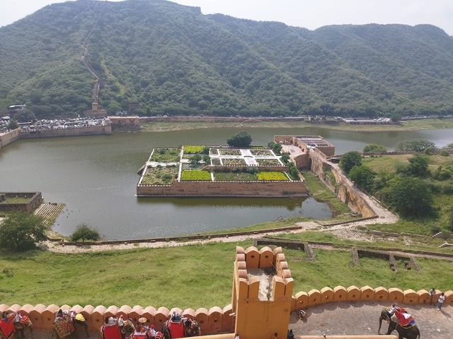       Garden island in a lake surrounded by fort walls.
  