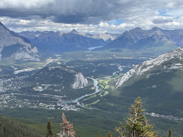       A sweeping landscape view of valleys and mountains.
  