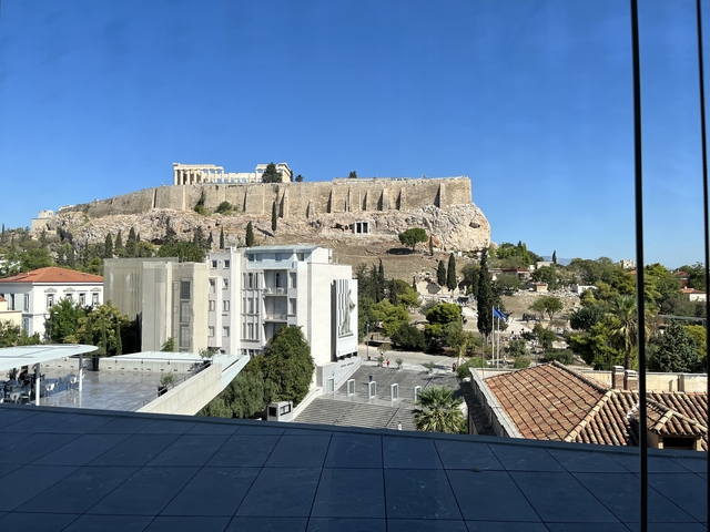       View of the Acropolis and surrounding cityscape
  