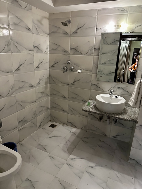 Bathroom with a shower and sink.