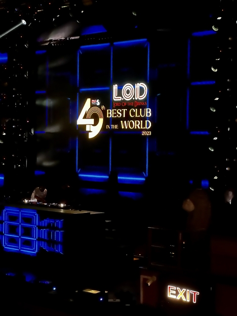 A nightclub interior with a sign reading 'Best Club in the World 2023'.