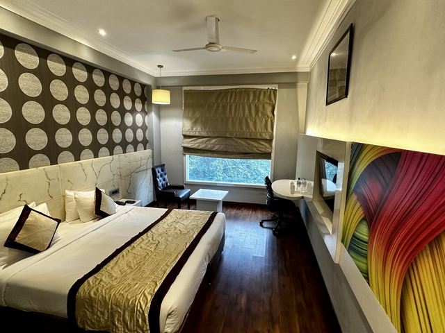 Modern hotel room with luxurious decor.