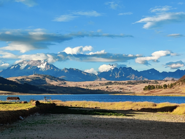       Scenic lake with mountains in the background.
  