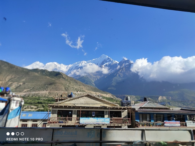 Mountains and village with clear blue sky.