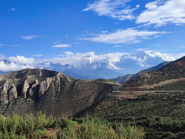 Mountainous terrain with snow-capped peaks.