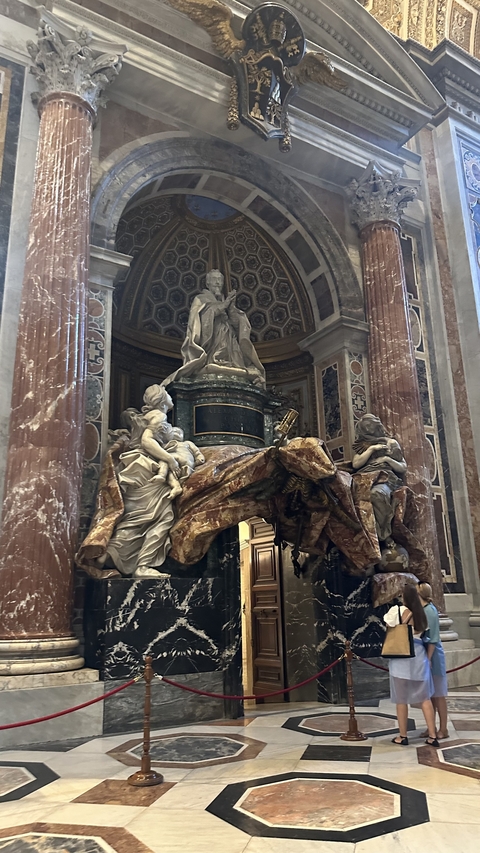 Intricate marble sculptures inside a grand building.