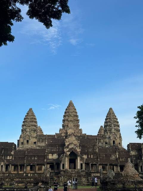 Angkor Wat temple complex with clear sky background.