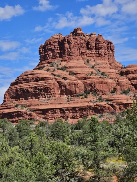 Bell Rock in Sedona under a blue sky.
