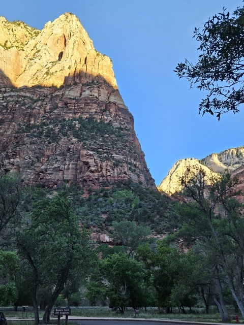 Steep canyon walls with a bright sky above.