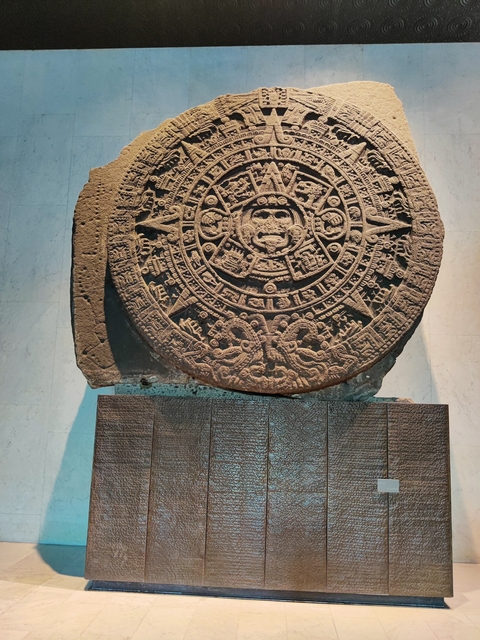 Mayan calendar stone on display.