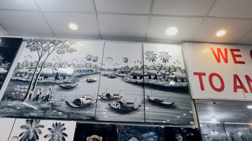 Black and white art pieces depicting a river scene.